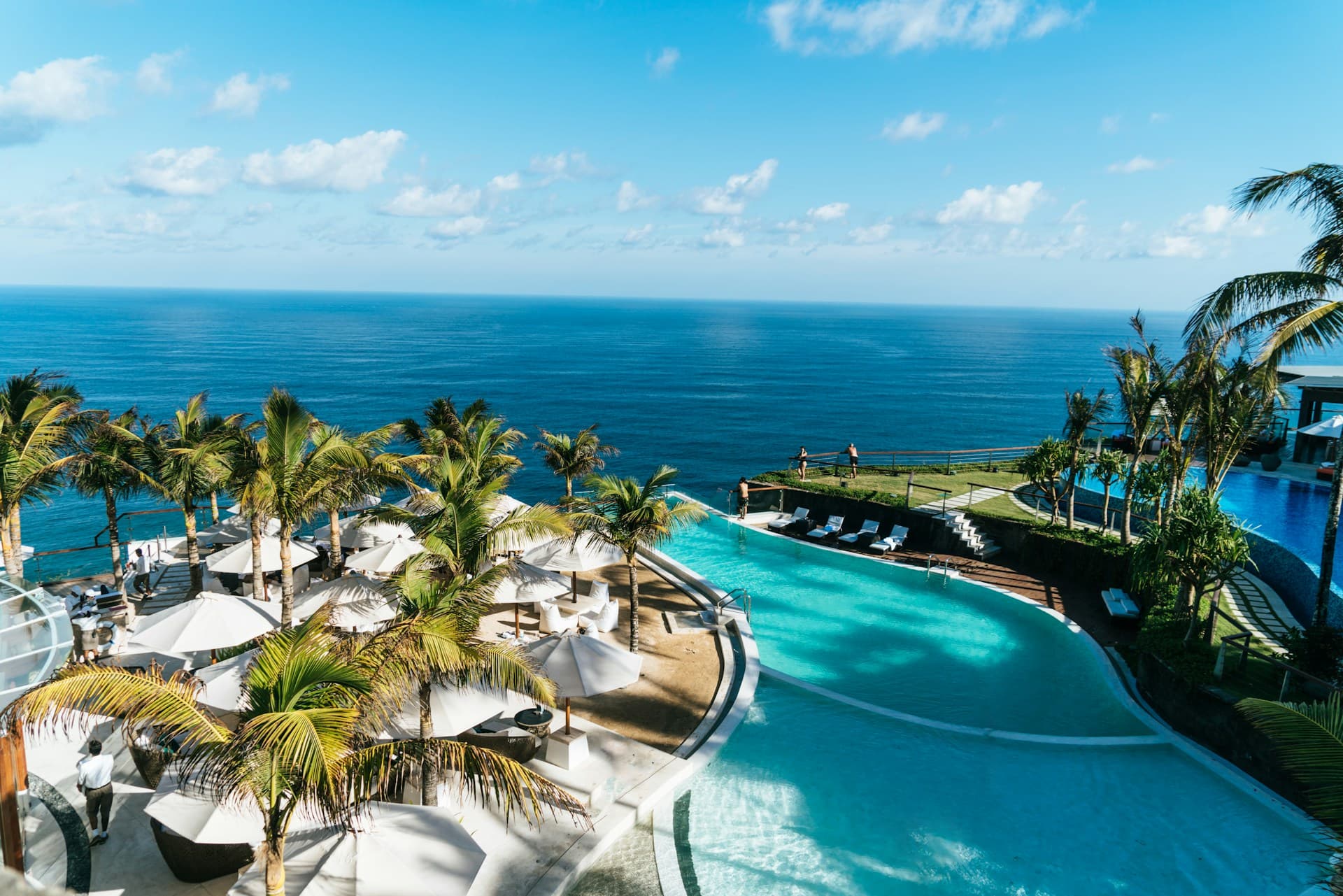 Infinity pool overlooking the ocean at a tropical resort
