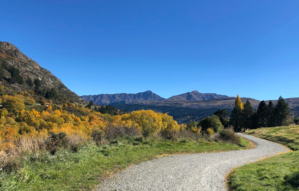 Romantic sunset scene in Queenstown, New Zealand — honeymoon guide